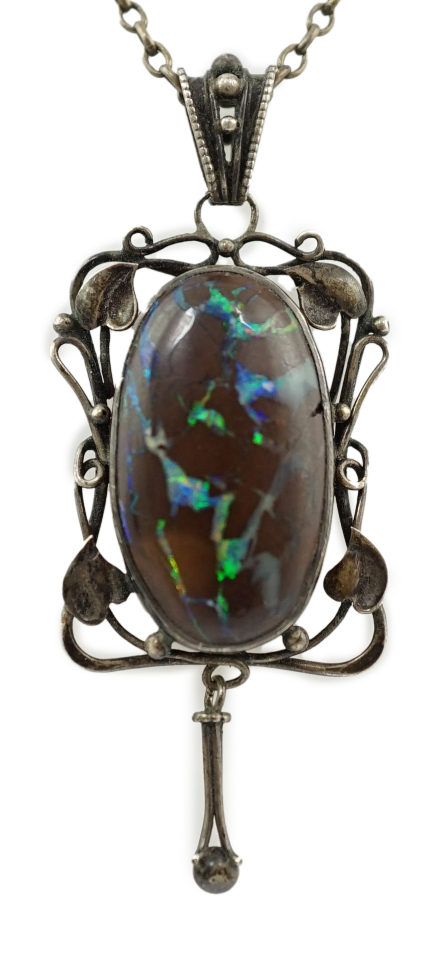 An Art Nouveau silver and oval black opal set drop pendant necklace